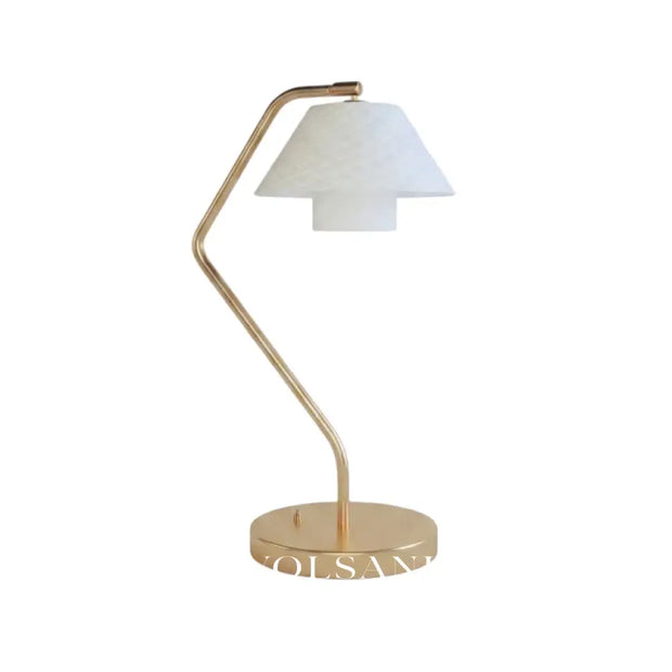 Ceramic table lamp with copper frame and quilted shade on a white background