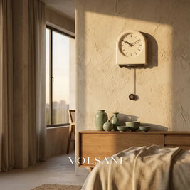 JOOST cream pendulum wall clock in white face in a bedroom