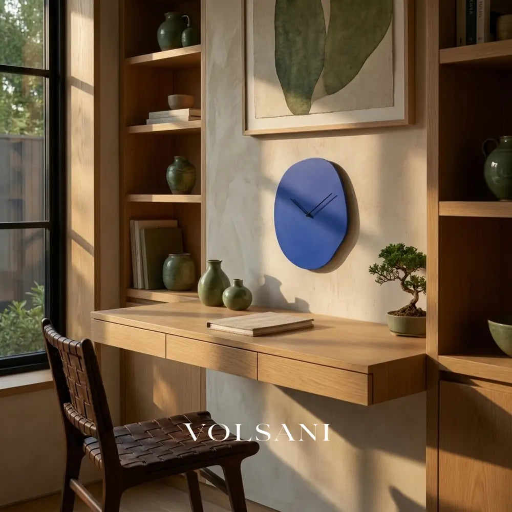 EERO minimalist wall clock in blue above a desk in a home office
