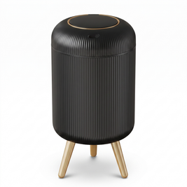 Black and gold motion sensor trash can with feet on a white background