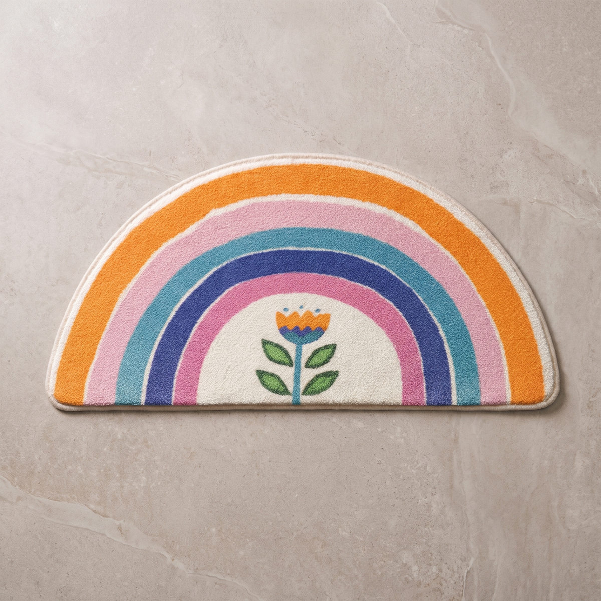 Floral Arc half moon bath mat, overhead on stone floor