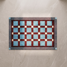 Teal checkerboard bath mat, overhead on stone floor