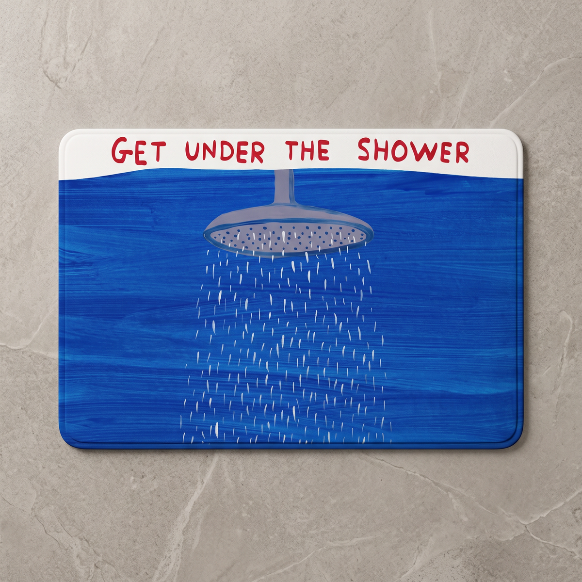 Solid blue quick dry shower mat, overhead on stone floor