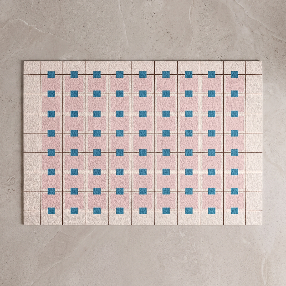 Pink Blue Star Bauhaus bath mat, overhead on stone floor