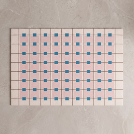 Pink Blue Star Bauhaus bath mat, overhead on stone floor