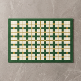 Green and white checkerboard bath mat, overhead on stone floor