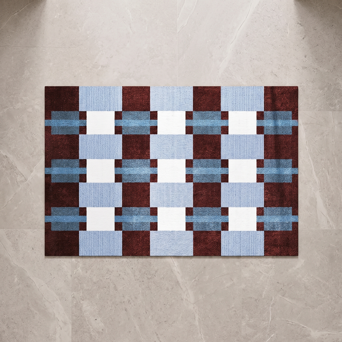 Blue white and grey checkerboard bath mat, overhead on stone floor