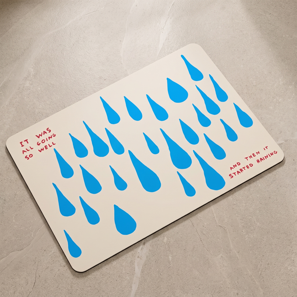 Blue dashes quick dry shower mat, overhead on stone floor