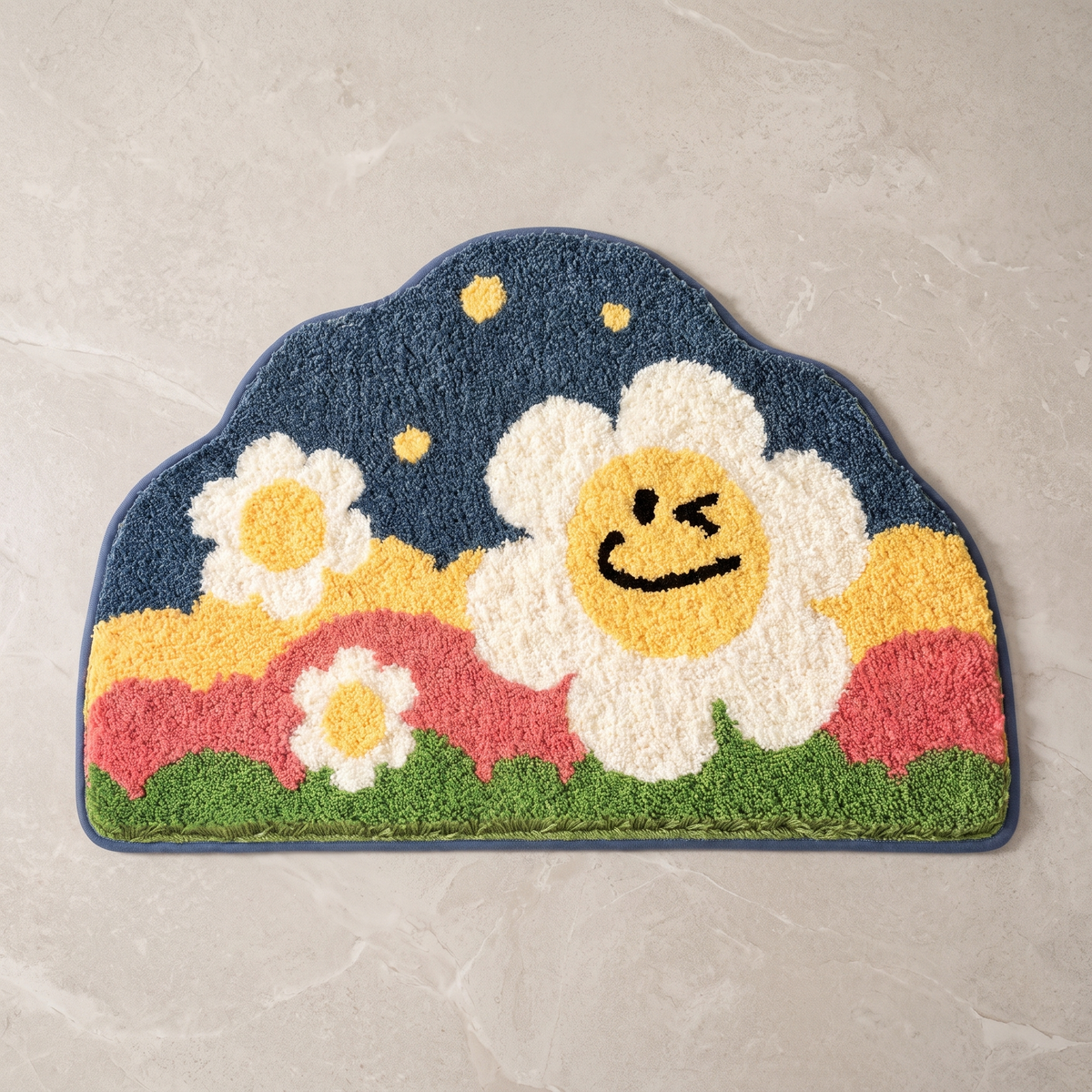 Smile design flower shaped bath mat, overhead on stone floor