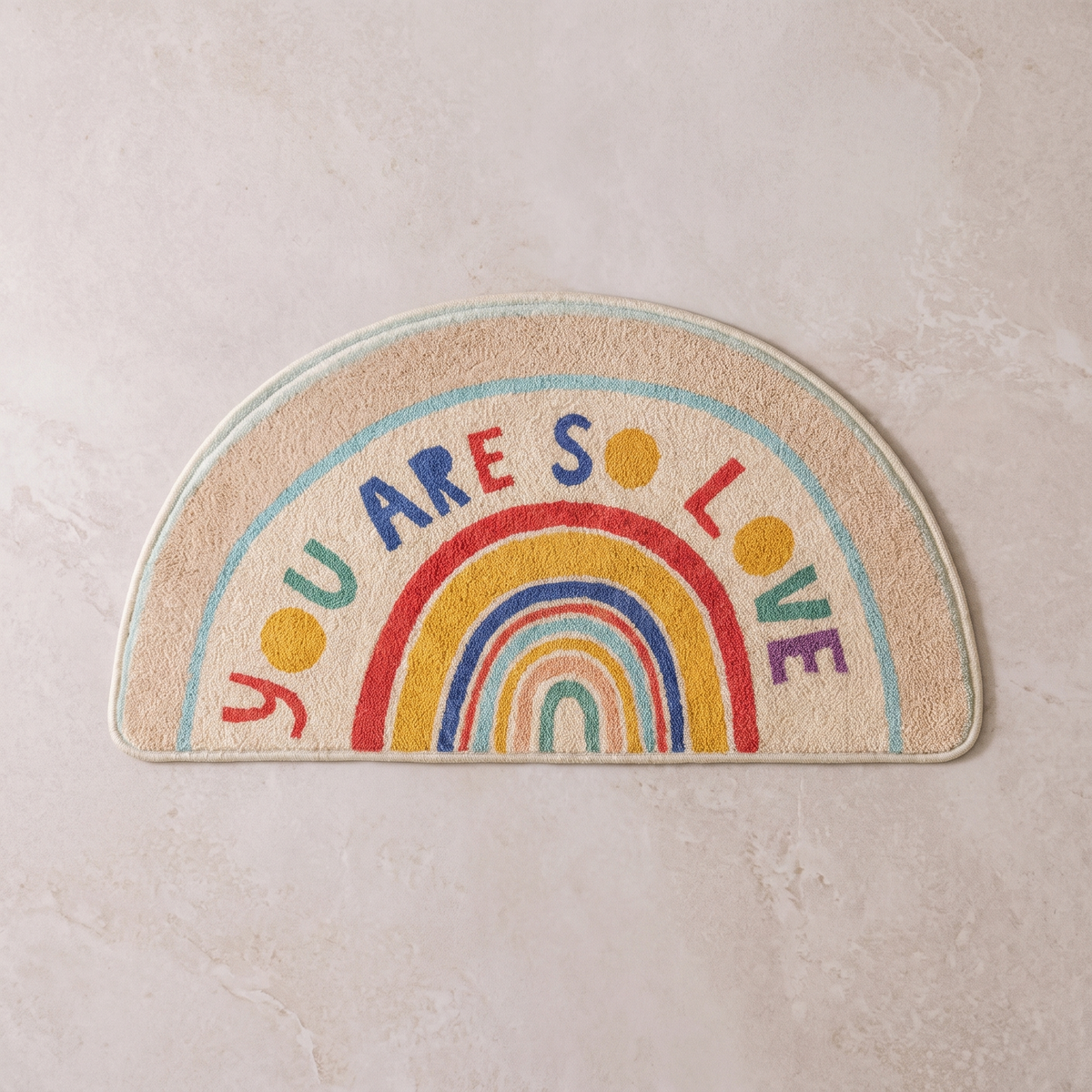 Loved Arc half moon bath mat, overhead on stone floor