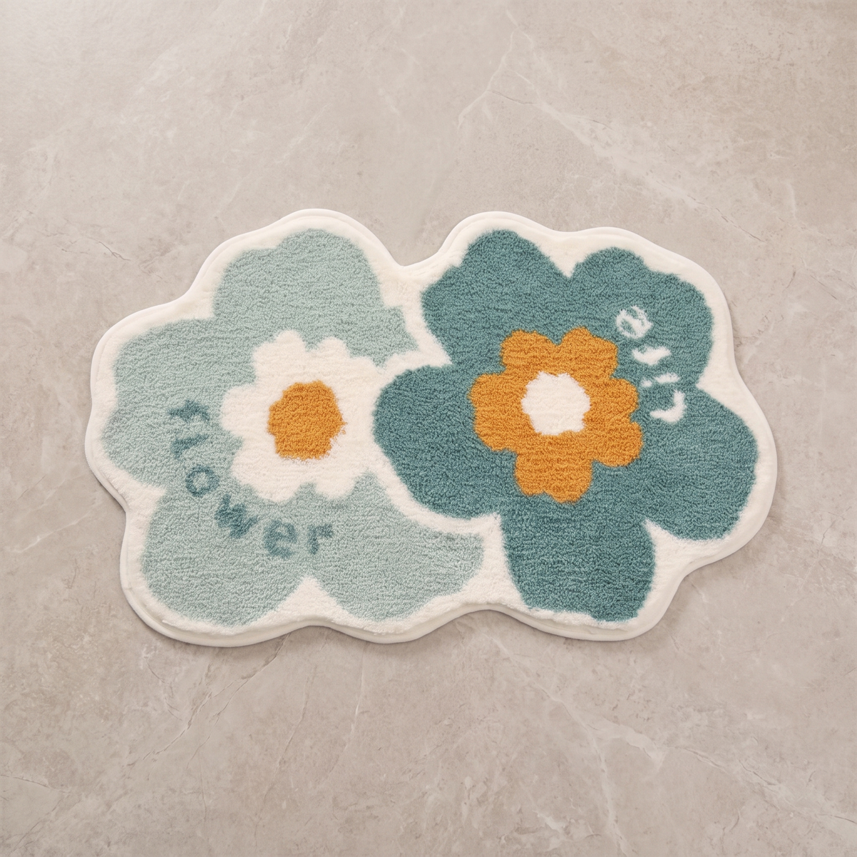 Whimsical Flower tufted floral bath mat, overhead on stone floor