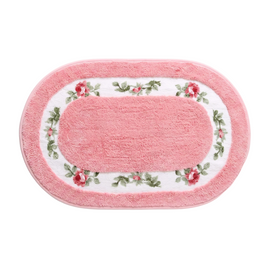 Oval floral bath mat on a white background, overhead