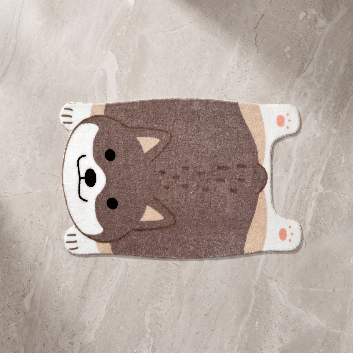 Brown animal motif floor mat on a pale stone floor, overhead