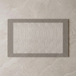 Fine Line Border diatomite bath mat on stone floor, overhead