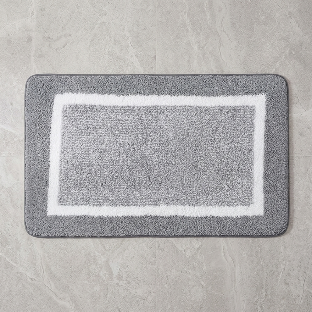 Beige striped microfiber bath mat on stone floor, overhead