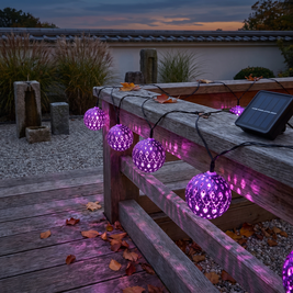 Moroccan filigree solar string lights on an oak railing