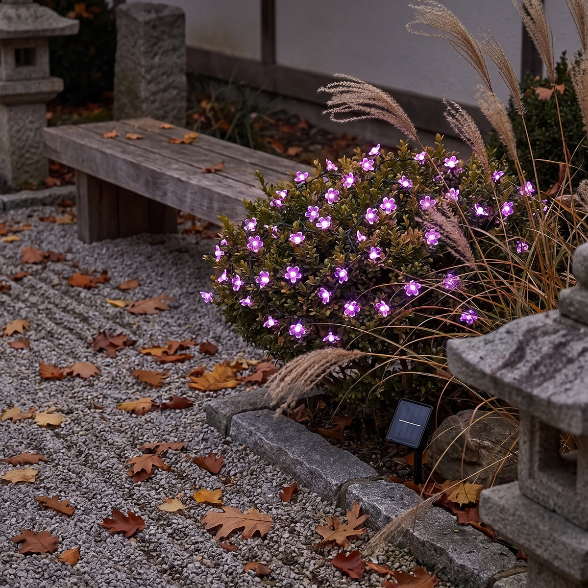 Purple cherry blossom solar string light in a garden shrub