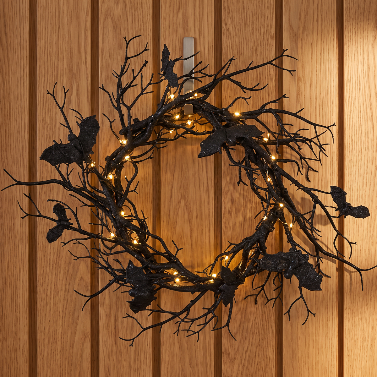 Black bat wreath on an oak front door