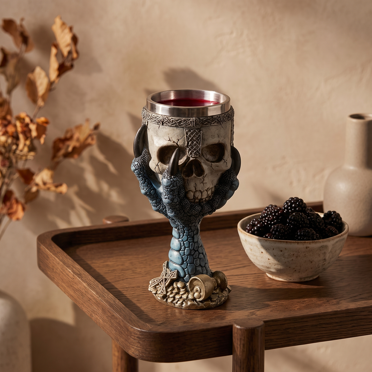 Stone look skull goblet on an oak bar cart