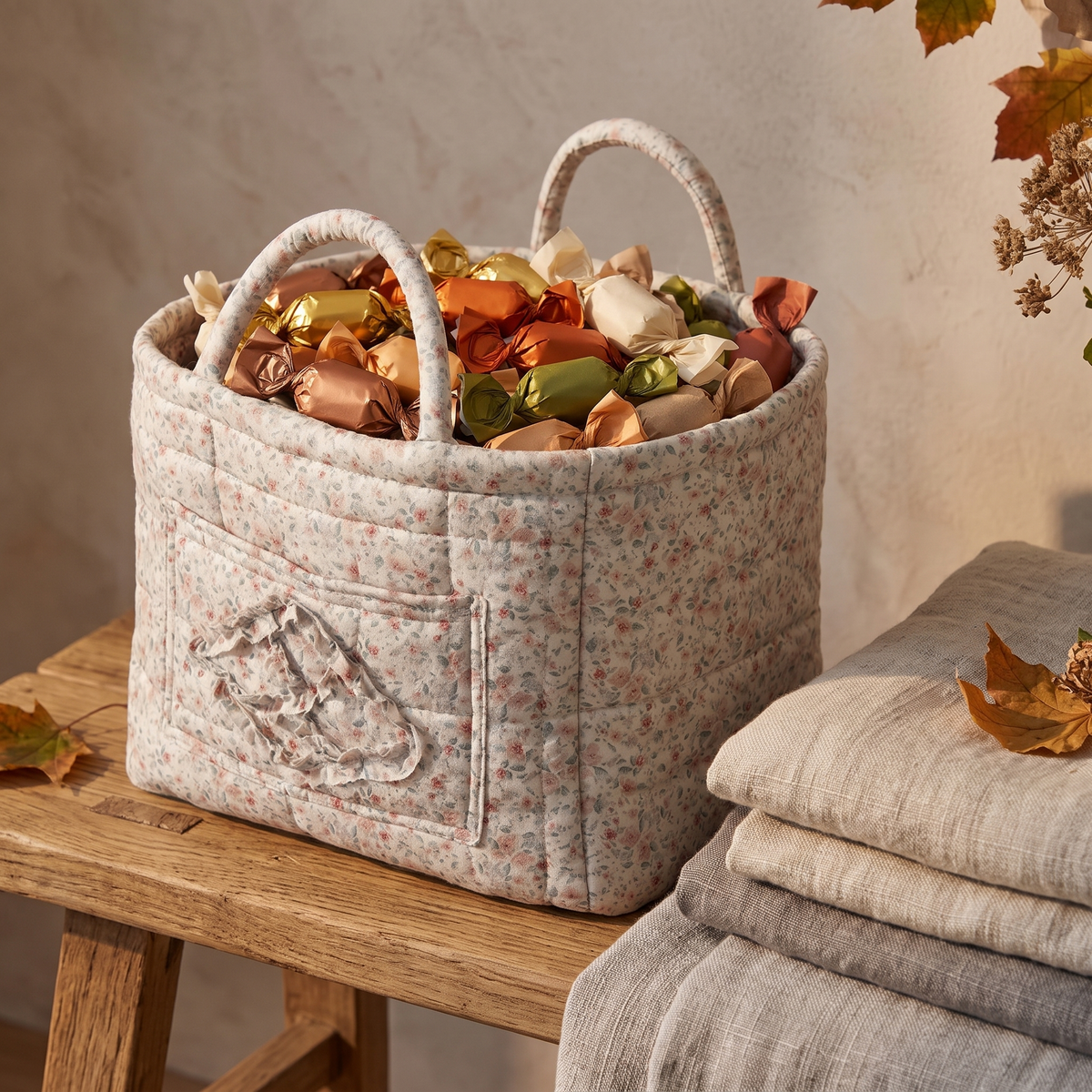 Grey floral quilted basket filled with wrapped candy