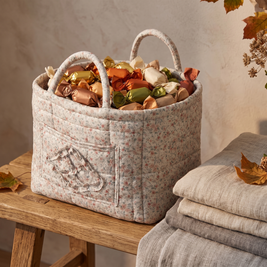 Grey floral quilted basket filled with wrapped candy