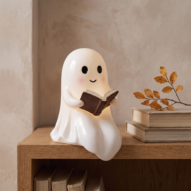 Ghost reading lamp on an oak bookshelf