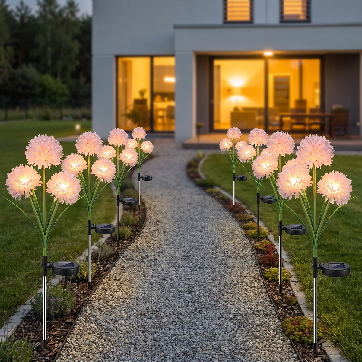 Solar flower stake lights along a gravel garden path