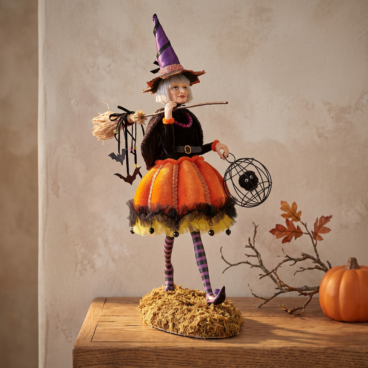 Witch figurine on an oak mantel shelf