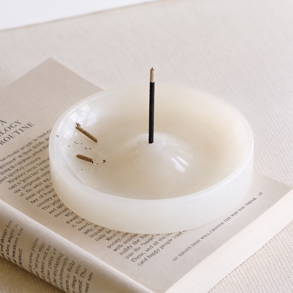 White stone incense holder on white background
