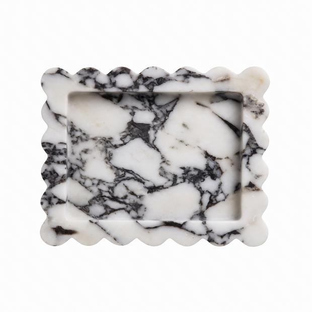 Black and white scalloped marble tray on white background