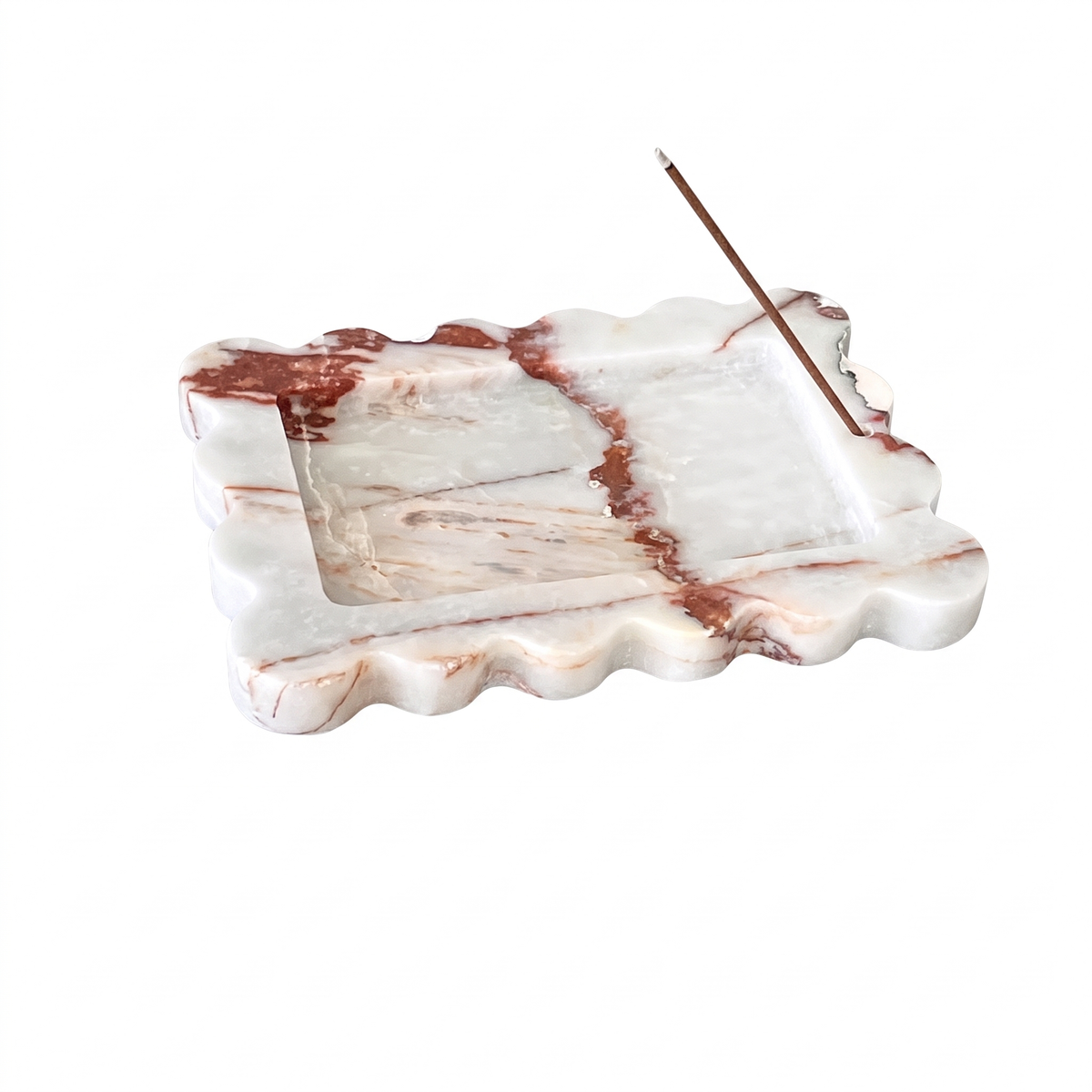 Rust scalloped marble tray on white background