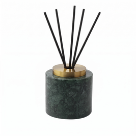 Round green marble incense holder on white background