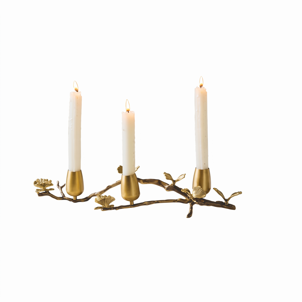 Brass ginkgo taper candle holder for 3 candles on white background