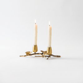 Brass ginkgo taper candle holder for 2 candles on white background