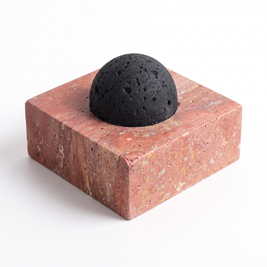 Red travertine lava stone oil diffuser on white background