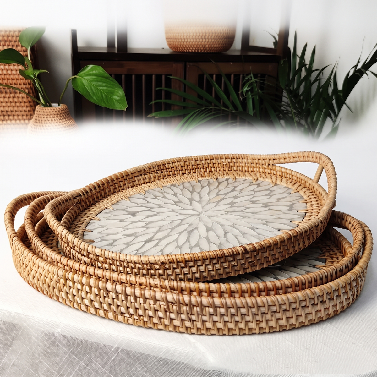Rattan serving tray with white petal shell inlay on white background