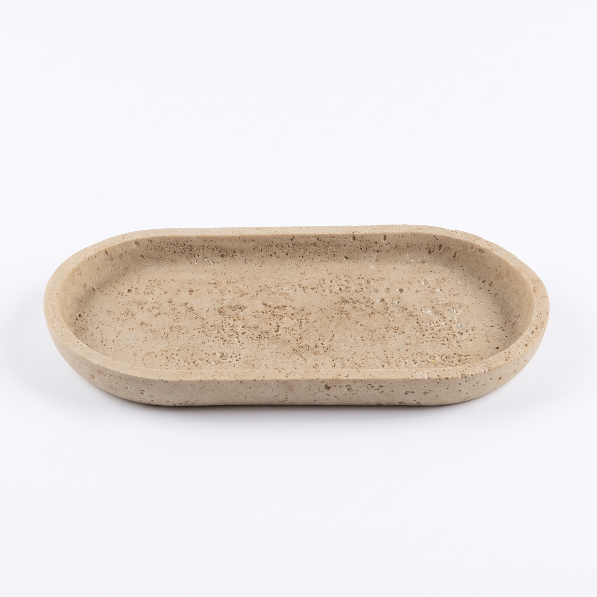 Oval sandstone vanity tray on white background