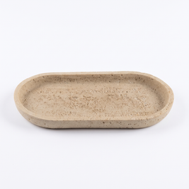 Oval sandstone vanity tray on white background