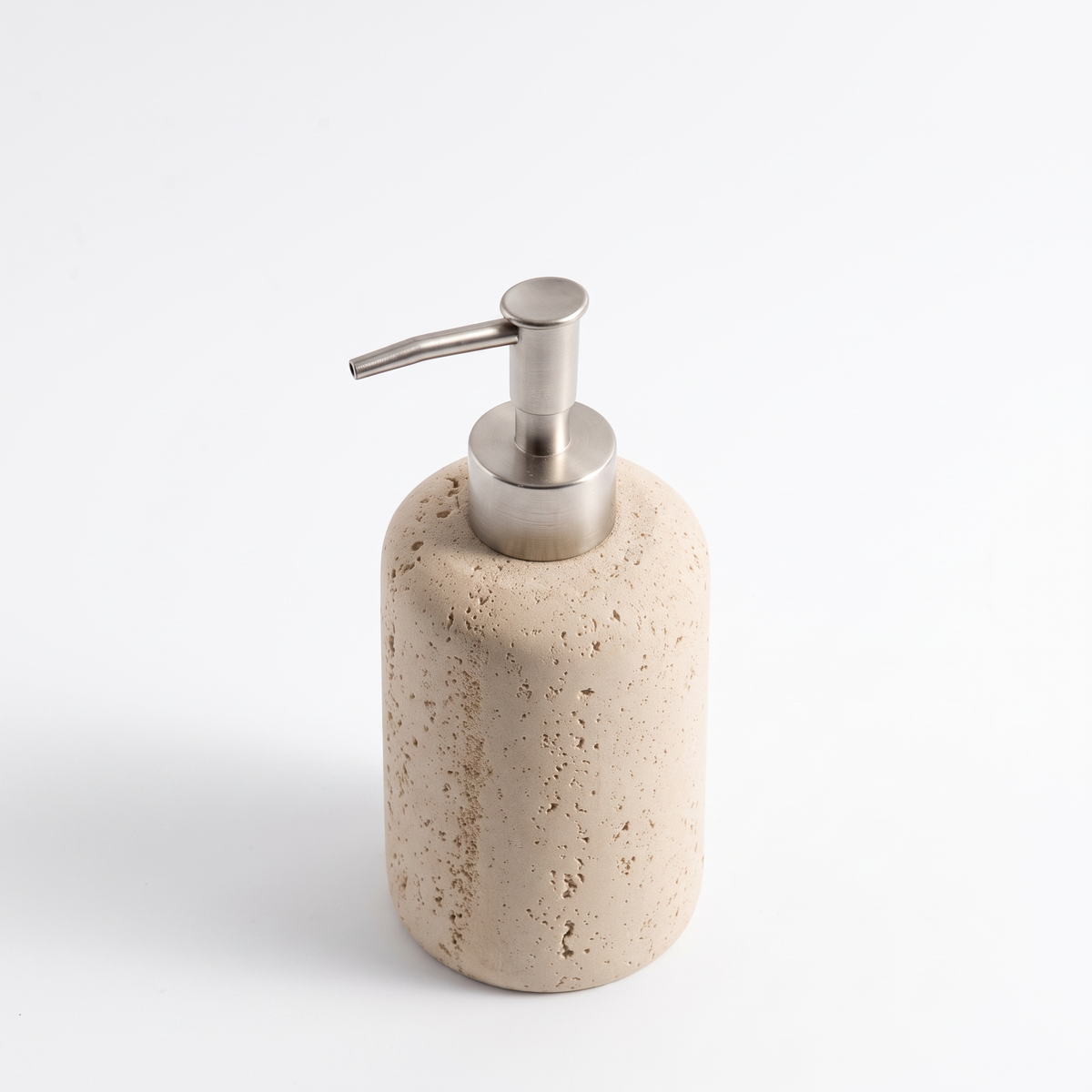 Sandstone soap dispenser on white background