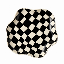 Black checkered ceramic tray on white background
