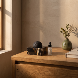 Portoro black marble lava stone oil diffuser styled on an oak bedside table