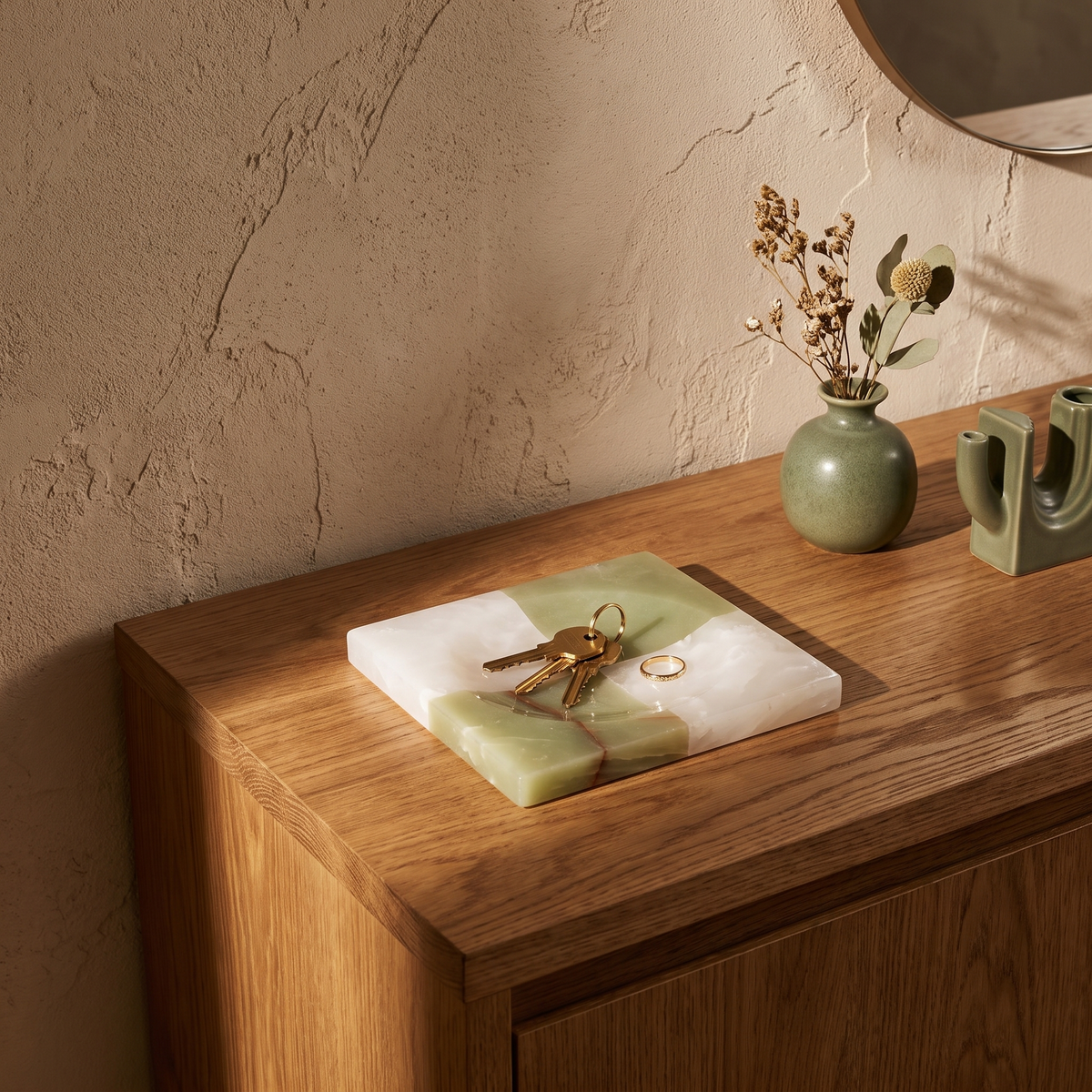 Square jade checkered marble tray styled on an oak entryway console