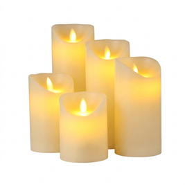 Set of flameless LED pillar candles on a white background