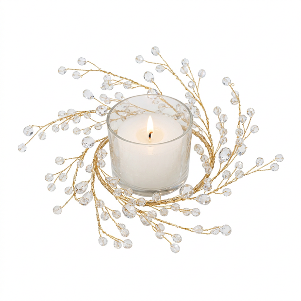 Gold branch candle ring with acrylic gems on a white background