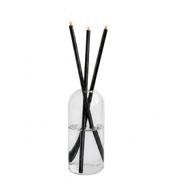 Set of refillable glass oil candles with steel wicks on a white background
