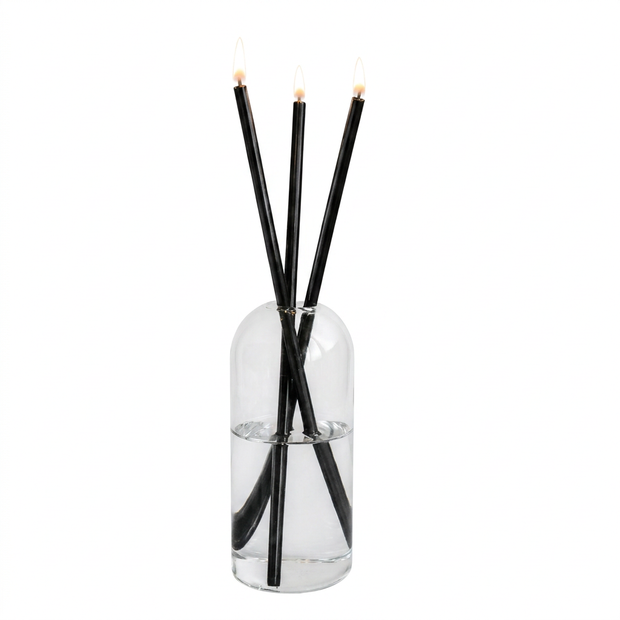 Set of refillable glass oil candles with steel wicks on a white background