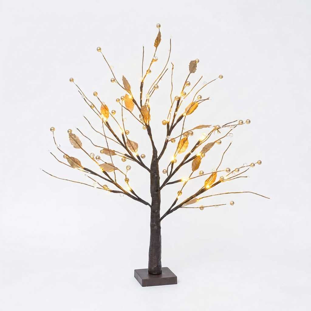 Gold lighted tabletop twig tree with LEDs on a white background