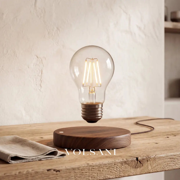 Close-up of the levitating lamp showing the floating gap above the wood base