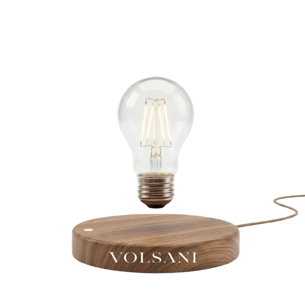 Levitating table lamp with floating bulb on a wood base, white background