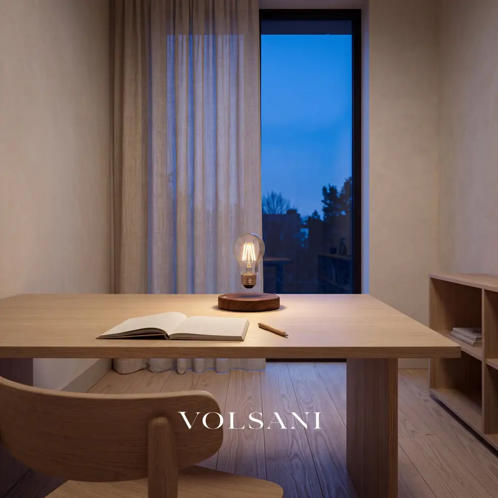 Levitating lamp with floating bulb lit on a desk in a Japandi home study at dusk